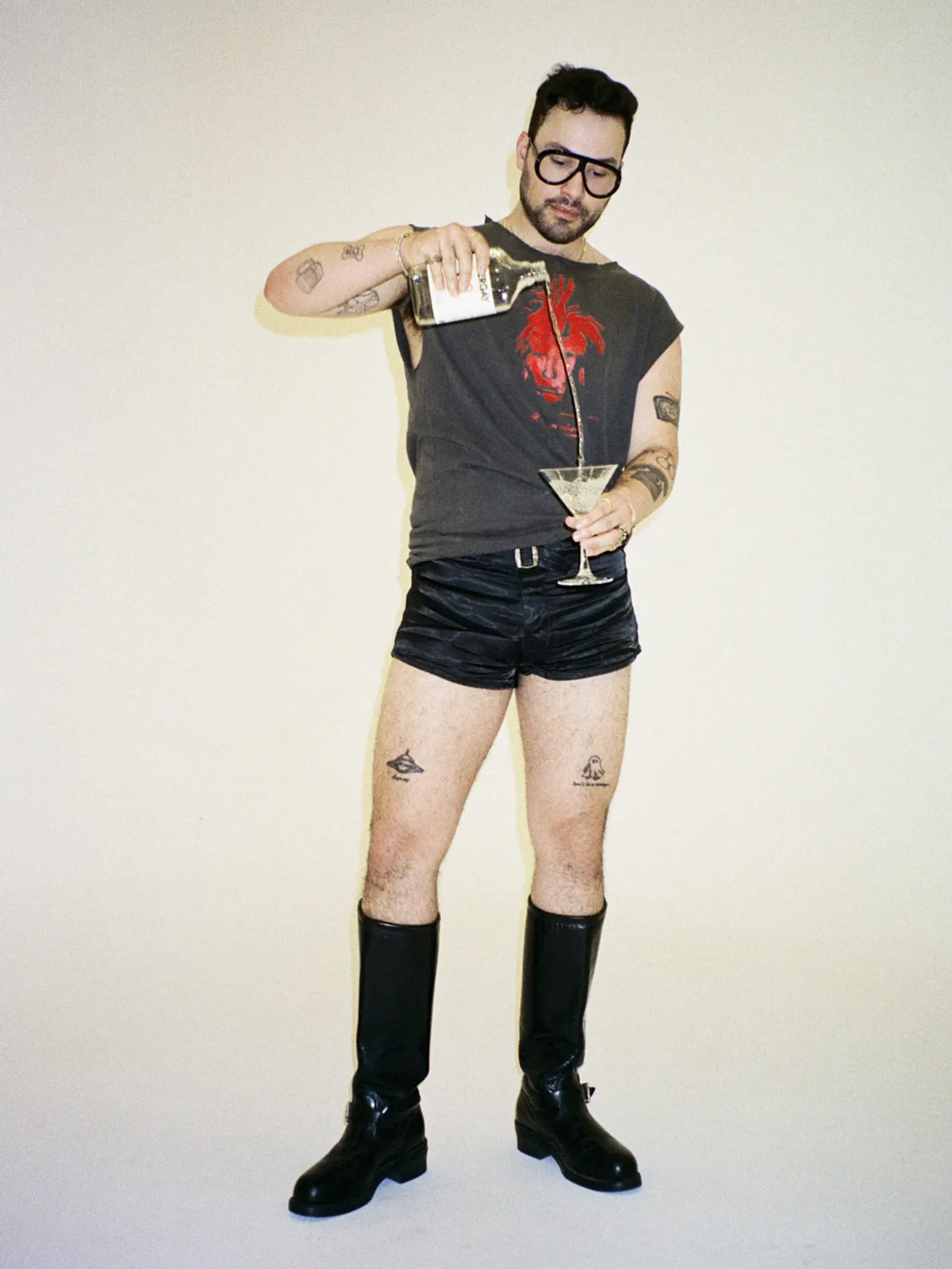 <p><span style="color:hsl(0,0%,100%);">SACRED &amp; THE PROFANE VINTAGE tank, shorts and boots, LOUIE's own jewelry and watch, LOUIE's own sunglasses.</span></p>