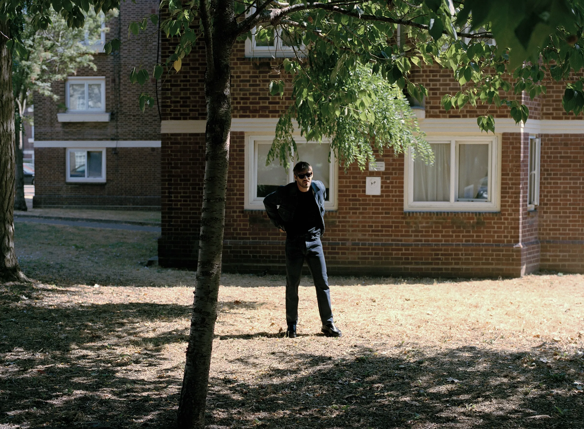 <p>JOHN SMEDLEY t-shirt, STONE ISLAND jacket and trousers, BIRKENSTOCK shoes, OMEGA watch, LACOSTE EYEWEAR glasses</p>